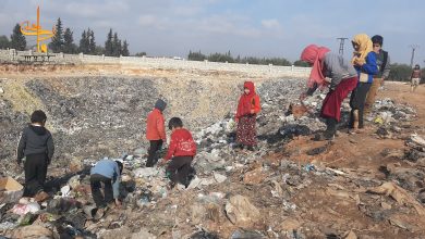 Photo of In northwestern Syria’s displacement camps, children search for warmth, income in garbage dumps